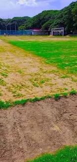 A vibrant football field with green grass on a sunny day.