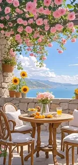 Sunny garden patio with flowers overlooking the sea.