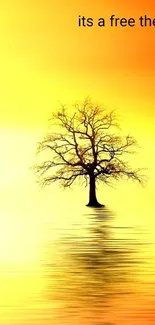 Solitary tree reflecting in bright yellow waters under a vibrant sunset sky.