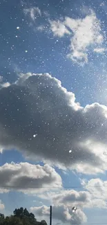 Sunny blue sky with fluffy clouds and sun rays shining through.