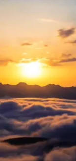 Golden sunrise over mountains with clouds.