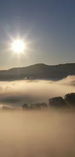 Sunrise over misty mountains with serene landscape.