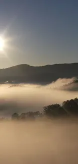 Sunrise over misty mountains with golden hues and tranquil scenery.