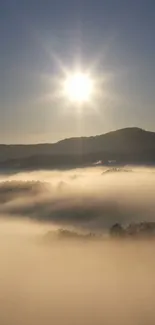 Beautiful sunrise over misty mountains with golden sunlight.