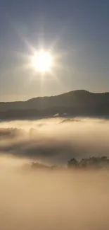 Sunrise over misty mountains with a golden glow and serene landscape.