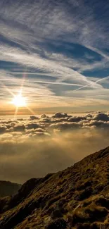 Sunrise over mountain peaks with clouds and vibrant sky.