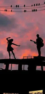 Silhouettes dancing on a van with a sunset sky background.