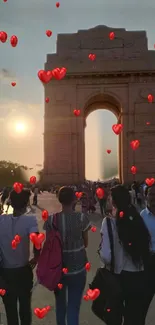 Sunset view of India Gate with floating red hearts.