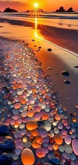 Vibrant sunset beach with colorful glass pebbles reflecting sunlight.