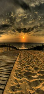 A beautiful sunset over a sandy beach path leading to the ocean.