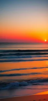 Vibrant sunset over a calm ocean beach scene.