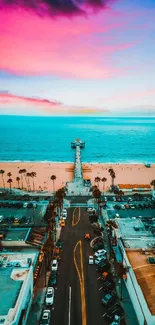 Aerial view of a pier with vibrant sunset and ocean backdrop.