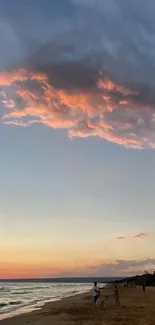 Peaceful beach sunset with soft peach clouds and tranquil ocean waves.