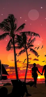 Romantic sunset beach wallpaper with palm trees and silhouettes.