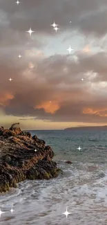 Sunset beach with stars in the sky and gentle waves hitting the shore.