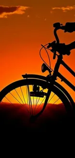 Bicycle silhouette against a vibrant orange sunset, creating a stunning mobile wallpaper.