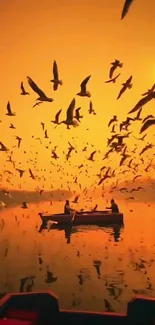 Vibrant sunset with birds flying over a tranquil lake.