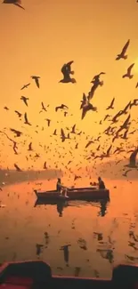 Birds flying over a lake at sunset with an orange sky.