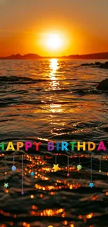 Colorful birthday text over a sunset ocean view.