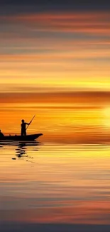 Tranquil sunset over water with silhouetted boat scene.