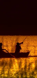 Silhouette of a boat on a golden sunset background with reflections on the water.