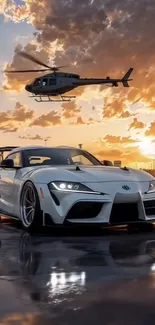 Sports car and helicopter at sunset.