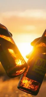 Two bottles clink at sunset, casting a warm golden glow.