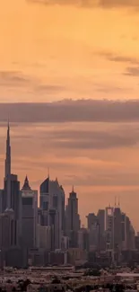 Orange sunset over a city skyline with tall skyscrapers.