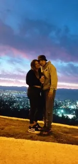 Couple embracing at sunset with city skyline backdrop.