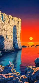 Vibrant sunset over ocean and cliffs, seagull perched on rocks.