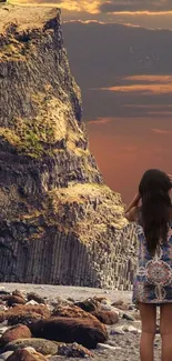 Woman stands by scenic cliff at sunset near the ocean.