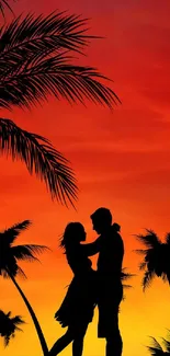 Silhouette of a couple with palm trees against a vibrant orange sunset.