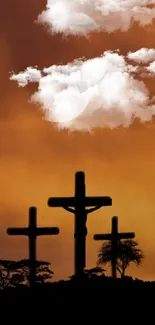 Sunset background with cross silhouettes and clouds.