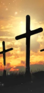 Silhouetted crosses with a sunset sky background.