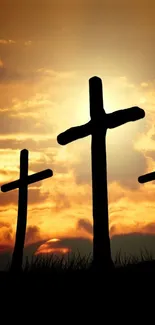 Mobile wallpaper with crosses at sunset.