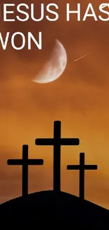 Silhouette of three crosses against a vibrant orange sunset with a moon in the sky.