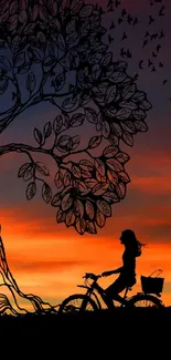 Silhouette of cyclist under a tree at sunset with vibrant sky.