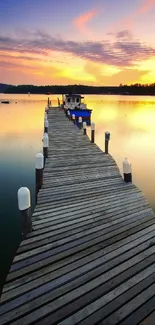 Serene sunset over a lake with a wooden dock extending into the water.