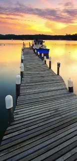 Sunset over a wooden dock leading into a tranquil lake with warm colors.