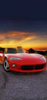 Red sports car on road with sunset backdrop.