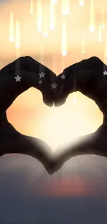 Hands forming a heart silhouette with a sunset background.