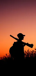 Silhouette of hunter against a beautiful sunset sky.