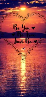 Inspirational heart silhouette at sunset over water, motivational quote included.