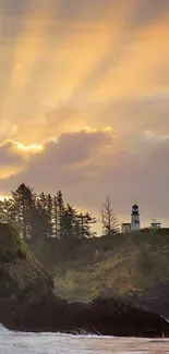 Mobile wallpaper of a sunset over a lighthouse with golden rays and ocean view.