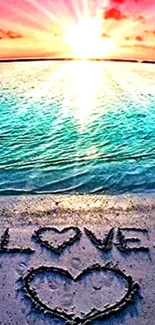 Romantic beach sunset with 'LOVE' inscribed in the sand.