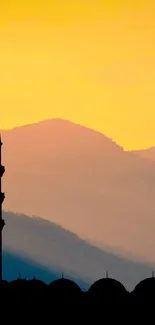 Silhouette of mosque and figure praying at sunset.