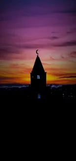 Mosque silhouette at sunset with purple and orange sky.