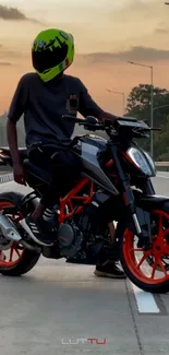 Motorcycle rider against a sunset background on a street.