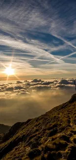 Sunset over a mountain landscape with hikers in silhouette.