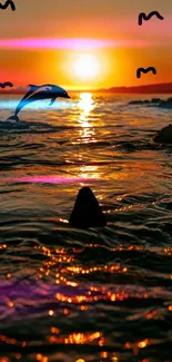 Dolphin jumping in the ocean at sunset with warm orange glow.